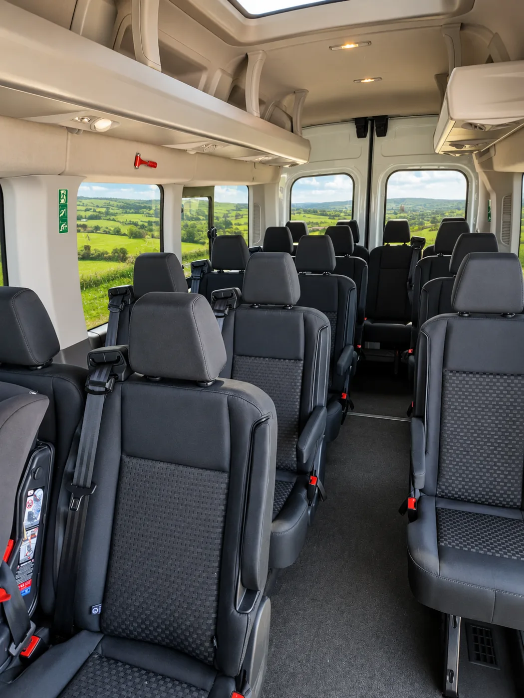 Comfortable individual passenger seating inside a 16-seat minibus